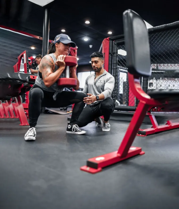 Coach Nate guiding a client through a training session in Orange, CA